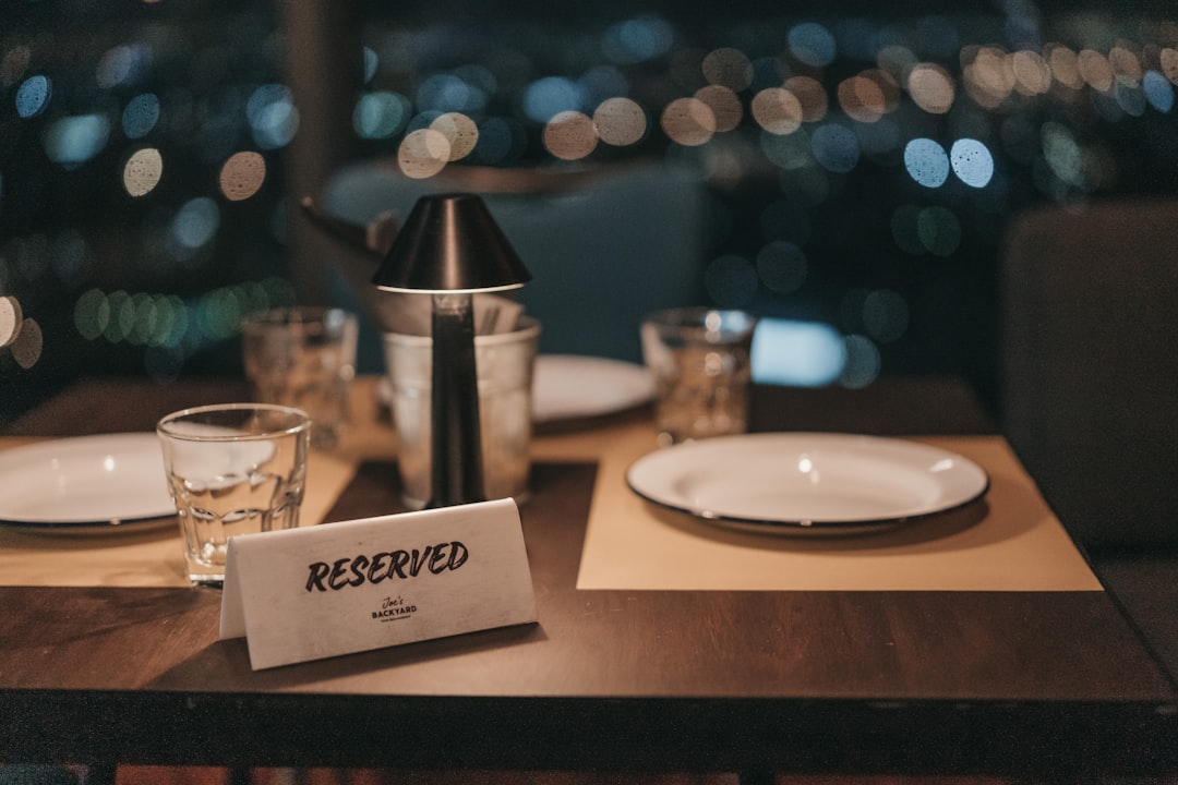 A neatly set fine-dining restaurant table seen from above — the kind of place where the bill at the end always gets awkward.
